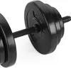 A close-up, studio shot of a black dumbbell with weight plates attached. Náhled obrázku produktu