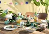 A table set for a children's party with a dinosaur theme. Produktbild-Vorschau