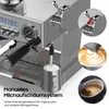Close-up view of a stainless steel espresso machine with various components and inset images demonstrating milk frothing. Produktbild-Vorschau