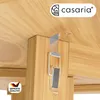 A close-up view of a metal latch mechanism attached to a wooden table leg, with a brand logo and quality seal visible. Produktbild-Vorschau