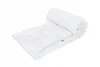 A white duvet rolled up and laid out on a white background. Produktbild-Vorschau