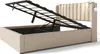 A beige upholstered bed frame with the mattress support mechanism lifted, revealing the storage space underneath. Two small reading lights are attached to the headboard. Náhled obrázku produktu