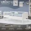 A white wooden cot is shown in a child's room setting, with decorative elements and feature callouts. Produktbild-Vorschau