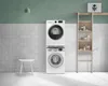 A stacked washing machine and dryer unit in a laundry room with a stool and shelving unit. Anteprima dell’immagine prodotto