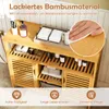 A bathroom cabinet made of bamboo material with various bathroom accessories and towels displayed. Podgląd zdjęcia produktu