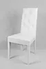 A white tufted dining chair against a light gray background. Voir les images du produit