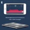 A smartphone displaying a weight tracking app is shown above a smart scale. Produktbild-Vorschau
