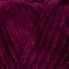 A close-up, textured view of dark purple yarn. Náhled obrázku produktu