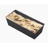 A loaf of bread dough with seeds on top, in a loaf pan. Podgląd zdjęcia produktu