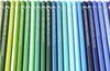 A close-up view of a row of colored pencils, showing their labels. Podgląd zdjęcia produktu