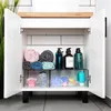 An open bathroom cabinet with organized toiletries and towels. Anteprima dell’immagine prodotto