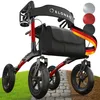 A red and black rollator with a black bag is shown on a path with grass and dirt on the sides. There are color swatches in the upper right corner. Produktbild-Vorschau