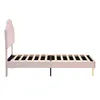 A side view of a pink upholstered bed frame with a wooden slat mattress support, shown against a white background. Produktbild-Vorschau