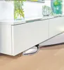 A white steam cleaner is positioned under a white cabinet. Anteprima dell’immagine prodotto
