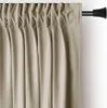 A close-up view of a beige curtain hanging from a curtain rod. Produktbild-Vorschau