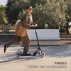 A woman riding a scooter in an outdoor park setting. Produktbild-Vorschau