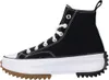 A side view of a black Converse Run Star Hike high-top sneaker with a white platform sole and a brown and black lug sole. Voir les images du produit