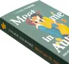 A close-up, angled view of the cover of a book titled 'Meet me in Autumn'. The cover features an illustration of a couple embracing, with autumn leaves scattered around. Produktbild-Vorschau