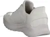 A white sneaker shown from a side-rear angle against a white background. Voir les images du produit