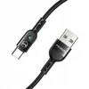 A close-up shot of a black USB-C charging cable with a USB-A connector on one end and a USB-C connector on the other. The cable has a braided texture and a small green LED light near the USB-C connector. Anteprima dell’immagine prodotto