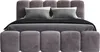 A modern upholstered bed with a tufted headboard and matching ottomans in front. Produktbild-Vorschau