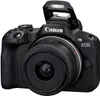 A black Canon EOS R50 mirrorless camera with its pop-up flash extended, shown from a front-facing angle against a white background. Voir les images du produit