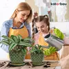 A mother and daughter are watering plants indoors. Náhled obrázku produktu