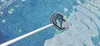 A pool skimmer net is being used to clean a swimming pool. Produktbild-Vorschau