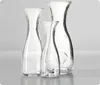Three glass carafes of varying sizes are displayed against a light gray background. Produktbild-Vorschau