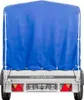 The back view of a blue tarp-covered trailer is shown against a white background. Podgląd zdjęcia produktu