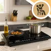 A modern kitchen counter with an electric induction cooktop. Voir les images du produit