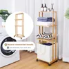 A bamboo shelving unit with a laundry basket, placed next to a washing machine in a laundry room. Anteprima dell’immagine prodotto