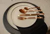 A table setting with plates and copper cutlery. Náhľad obrázku produktu