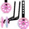 A set of pink training wheels with LED lights and black support arms for a child's bicycle, shown against a white background. Produktbild-Vorschau