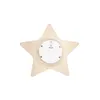 The back of a wooden star-shaped LED night light is shown against a white background. A circular battery compartment with a switch is visible in the center. Náhled obrázku produktu