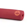 A rolled-up yoga mat with a logo on it, placed on a white background. Produktbild-Vorschau