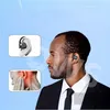 A man wearing a suit and tie is shown with a translation earphone in his ear. Inset images show the earphone in an ear and a diagram of ear pain. Produktbild-Vorschau