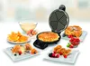 Tellern mit Waffeln, Früchten, Eis, Sirup, Schüssel mit Teig, Eiern, Mehl und Orangenscheiben.  Produktbild-Vorschau