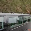 A black van with roof racks parked in front of a green hedge. Podgląd zdjęcia produktu