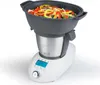 A white and silver multi-cooker with a gray steaming basket filled with colorful vegetables and noodles. Produktbild-Vorschau