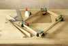 A workbench with woodworking tools and materials for assembling a frame. Produktbild-Vorschau