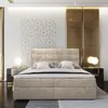 A luxurious bedroom with a large bed, elegant wall paneling, and modern bedside tables with lamps. Produktbild-Vorschau