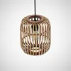 A pendant light with a rattan shade and a visible light bulb. Produktbild-Vorschau