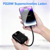 A person is holding a smartphone and a portable charger, demonstrating the charging process. Produktbild-Vorschau