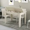 A dining table with its lid open, revealing storage space, in a kitchen or dining area. Anteprima dell’immagine prodotto