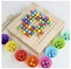 A wooden board game with colorful marbles and small cups. Voir les images du produit