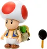 A Toad action figure from The Super Mario Bros. Movie, with a backpack and a frying pan accessory, set against a white background. Anteprima dell’immagine prodotto