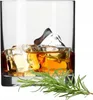 A glass of whiskey with ice and a sprig of rosemary. Anteprima dell’immagine prodotto
