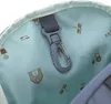 A close-up view of the interior lining of a backpack, showing a printed pattern and a carabiner clip. Produktbild-Vorschau
