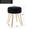 A black velvet stool with gold metal legs is shown with dimensions and maximum load information overlaid. Podgląd zdjęcia produktu